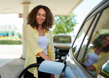 Woman filling up car